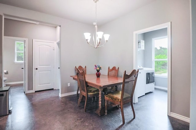 12029 Eagle Ln, North Zulch, TX 77872 - dining room featuring a chandelier, finished concrete floors, and washer and clothes dryer