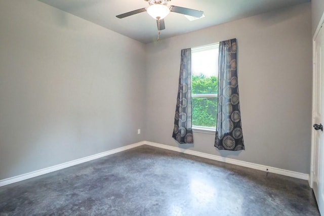 12029 Eagle Ln, North Zulch, TX 77872 - spare room featuring concrete flooring, plenty of natural light, and ceiling fan