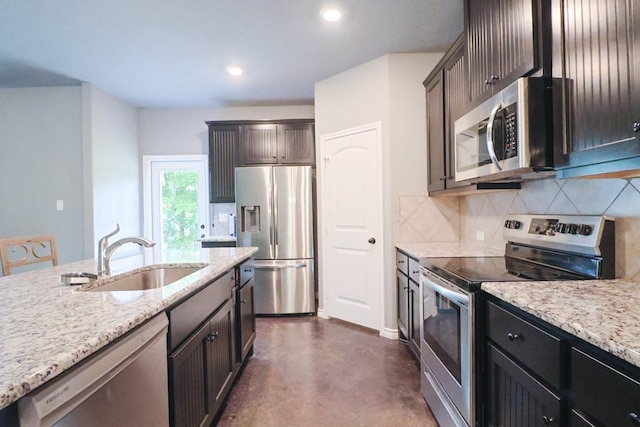 12029 Eagle Ln, North Zulch, TX 77872 - kitchen with stainless steel appliances, tasteful backsplash, finished concrete floors, light stone counters, and recessed lighting