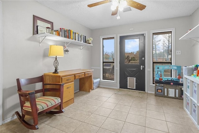 8700 Bent Tree Dr, College Station, TX 77845 - living area with a textured ceiling, a ceiling fan, light tile patterned floors, and an office area