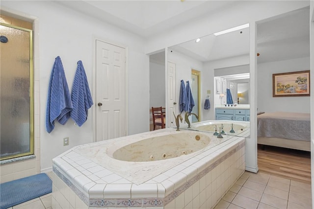 8700 Bent Tree Dr, College Station, TX 77845 - ensuite bathroom with tile patterned flooring, a stall shower, and a tub with jets