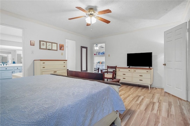 8700 Bent Tree Dr, College Station, TX 77845 - bedroom with light wood-type flooring, ornamental molding, a textured ceiling, connected bathroom, and a ceiling fan