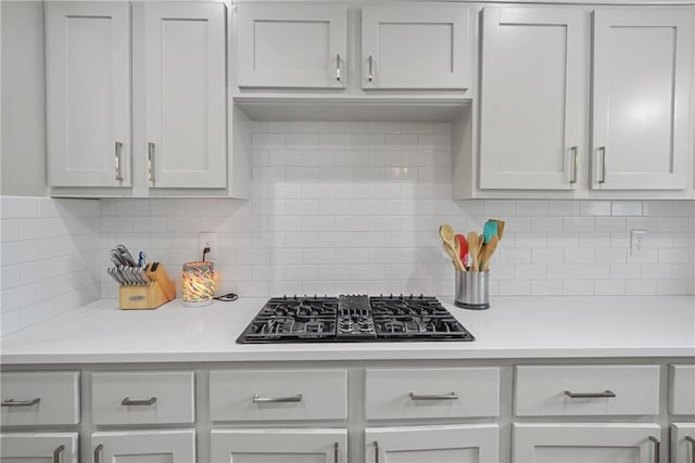 8700 Bent Tree Dr, College Station, TX 77845 - kitchen featuring black gas stovetop, light countertops, and backsplash