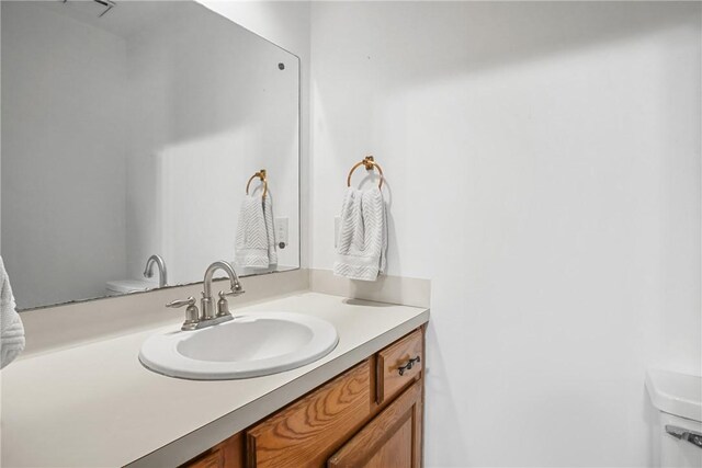 8700 Bent Tree Dr, College Station, TX 77845 - bathroom featuring vanity and toilet