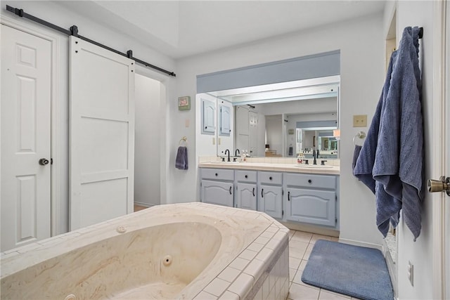 8700 Bent Tree Dr, College Station, TX 77845 - full bathroom featuring a whirlpool tub, double vanity, and tile patterned floors