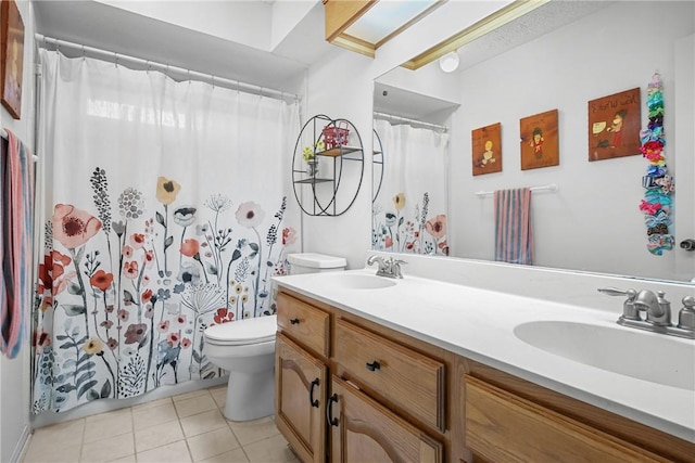 8700 Bent Tree Dr, College Station, TX 77845 - bathroom featuring toilet, double vanity, tile patterned floors, and curtained shower