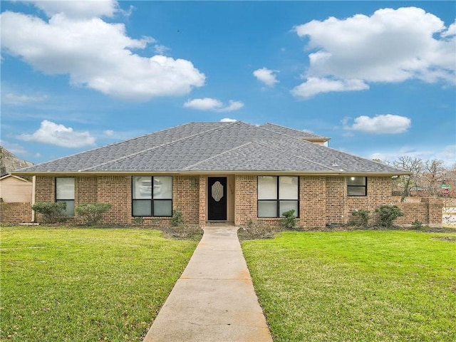 8700 Bent Tree Dr, College Station, TX 77845 - view of front of property with a front lawn, a shingled roof, and brick siding
