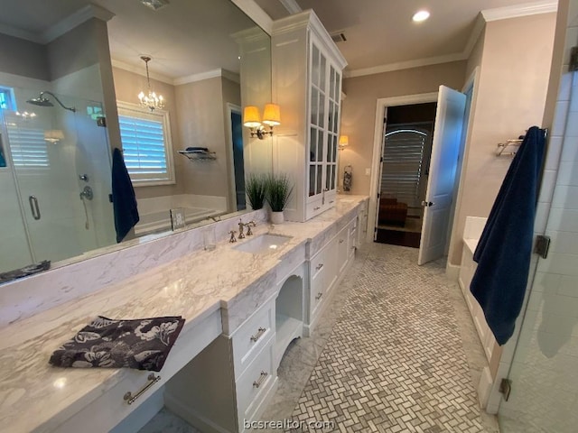 bathroom with shower with separate bathtub, vanity, crown molding, and a notable chandelier