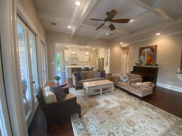 living room with beam ceiling, ceiling fan, coffered ceiling, and hardwood / wood-style flooring