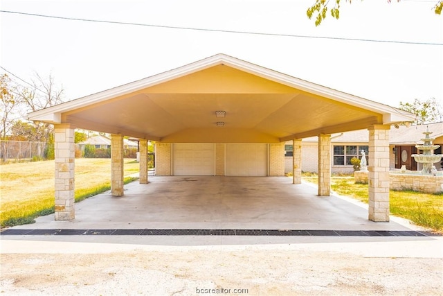 view of parking / parking lot with a garage and a carport