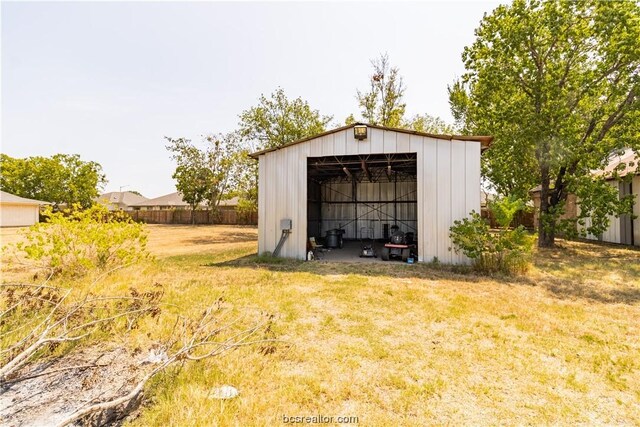 view of outbuilding featuring a yard