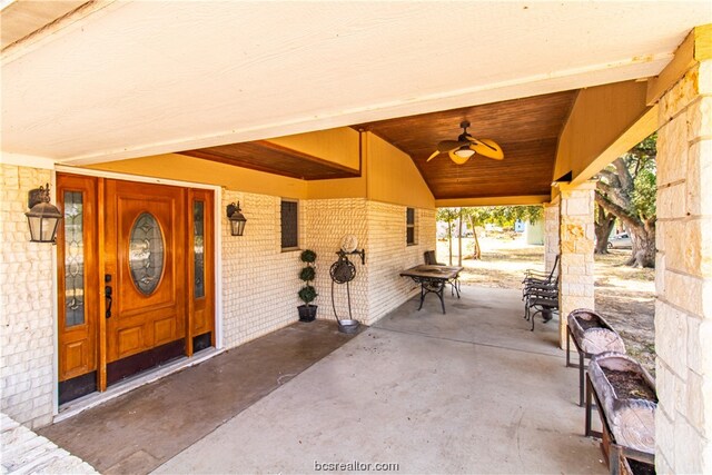 exterior space with ceiling fan