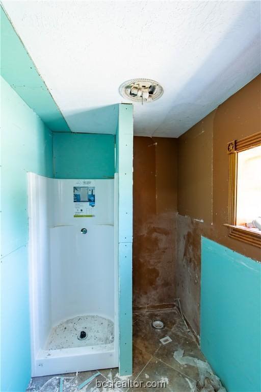 bathroom featuring a shower