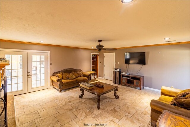 living room featuring french doors, ceiling fan, and crown molding