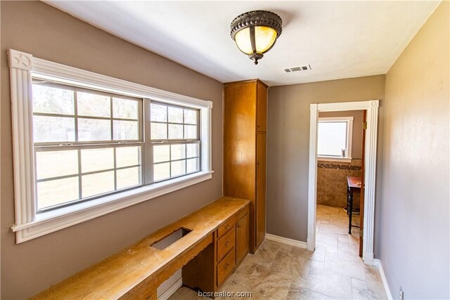 interior space featuring built in desk