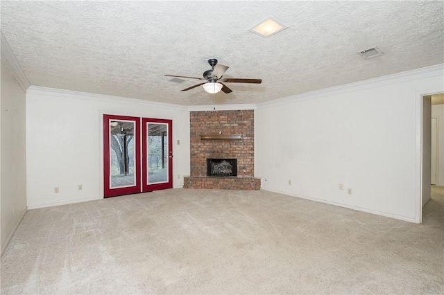 unfurnished living room with a brick fireplace, visible vents, light colored carpet, and ornamental molding