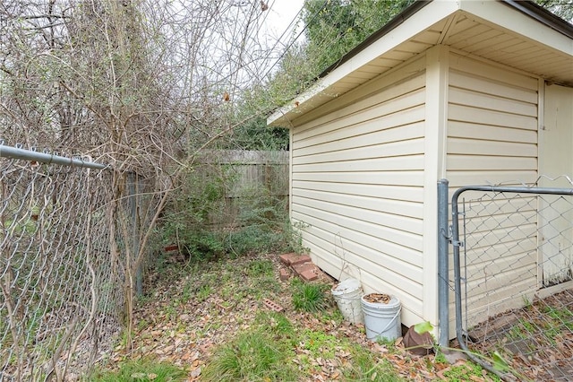 view of outdoor structure featuring fence