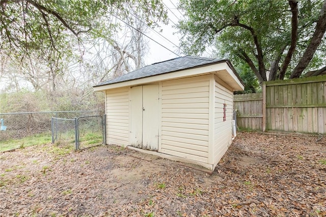 view of shed featuring a fenced backyard