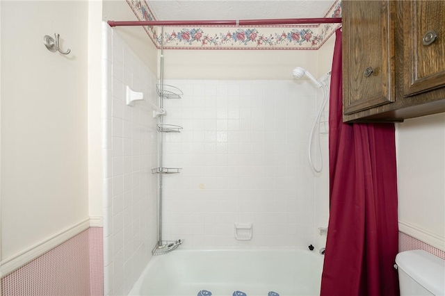 full bathroom with shower / bathtub combination with curtain and toilet