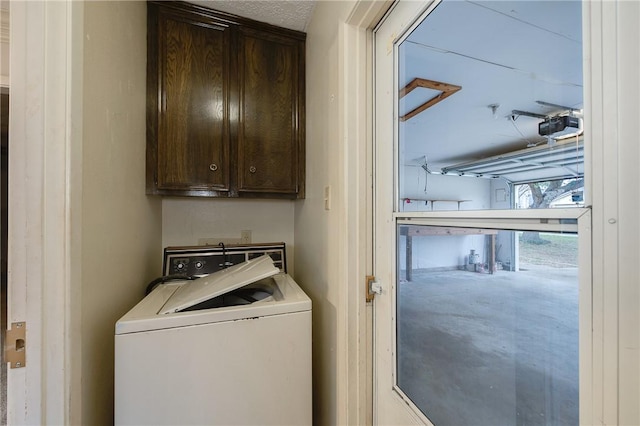 clothes washing area with cabinet space and washer / dryer