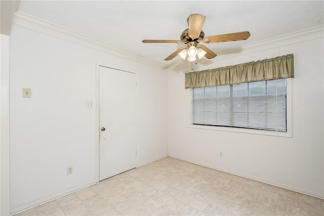 unfurnished room with light floors, a ceiling fan, and crown molding