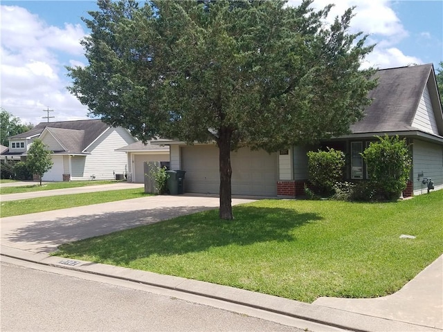 view of property hidden behind natural elements with a garage, brick siding, a front lawn, and concrete driveway