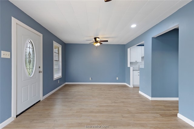 entryway with light hardwood / wood-style floors and ceiling fan