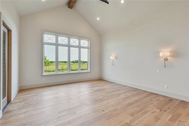 unfurnished living room with beam ceiling, high vaulted ceiling, and light hardwood / wood-style floors