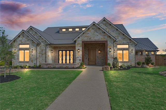 view of front of home with a yard