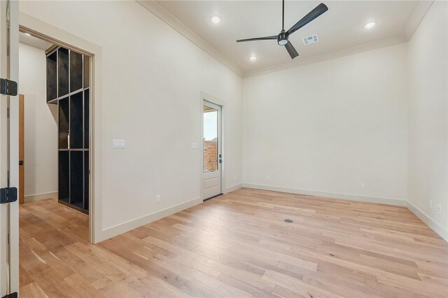 spare room with crown molding, ceiling fan, and light hardwood / wood-style floors