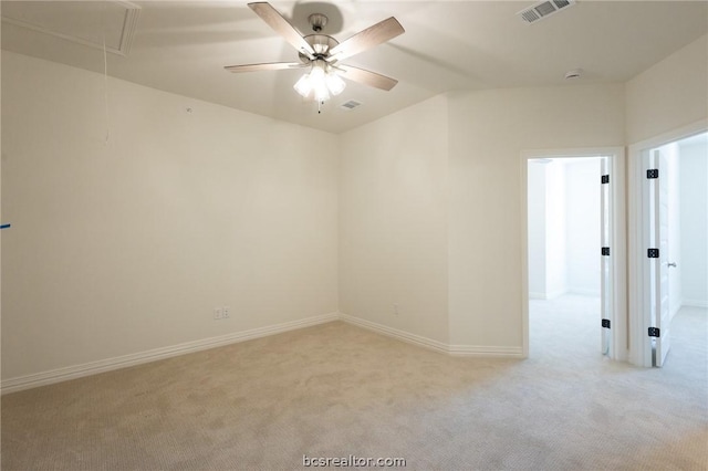 carpeted empty room featuring ceiling fan