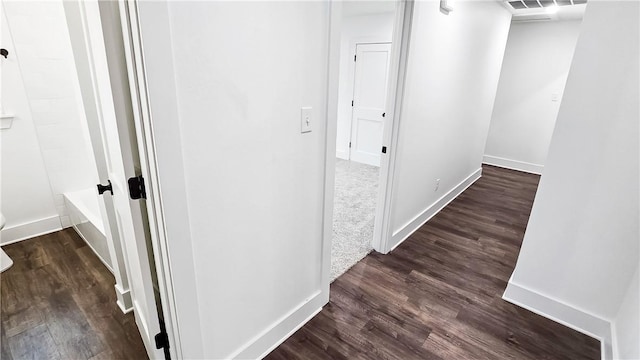 hall featuring dark wood-type flooring