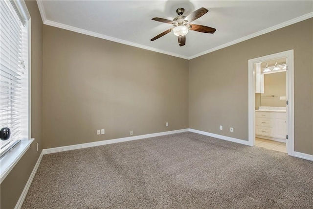 unfurnished room with baseboards, light carpet, ceiling fan, and ornamental molding