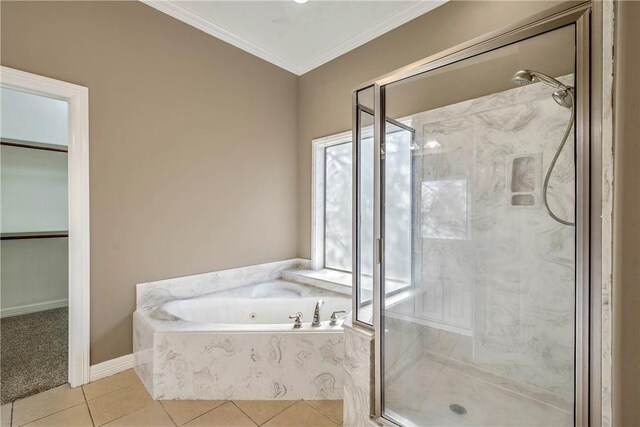 full bath with a marble finish shower, tile patterned flooring, a spacious closet, crown molding, and a bath