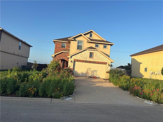 404 W Gemini Ln, Killeen, TX 76542 - view of front of house with stone siding, driveway, and a garage
