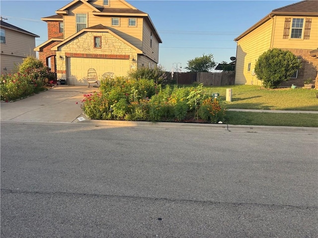 404 W Gemini Ln, Killeen, TX 76542 - craftsman-style house with stone siding, concrete driveway, and an attached garage