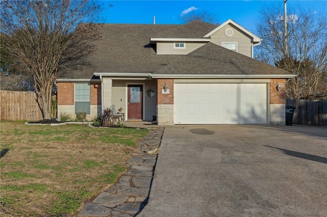 view of front property with a garage and a front yard