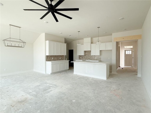 3148 Margaret Rudder Pkwy, Bryan, TX 77808 - kitchen featuring decorative backsplash, white cabinets, and pendant lighting