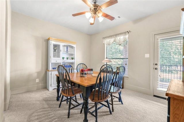 11376 Majestic Dr, Montgomery, TX 77356 - dining space with ceiling fan, light carpet, and baseboards