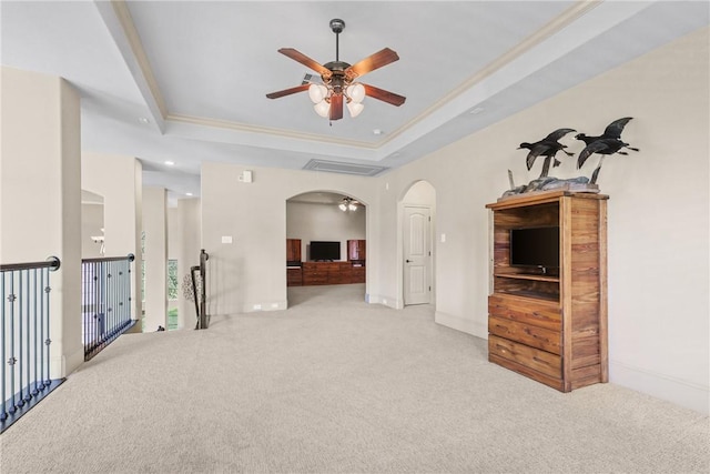 11376 Majestic Dr, Montgomery, TX 77356 - carpeted empty room featuring a ceiling fan, arched walkways, crown molding, a tray ceiling, and recessed lighting