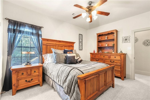 11376 Majestic Dr, Montgomery, TX 77356 - bedroom featuring light carpet, a ceiling fan, and baseboards