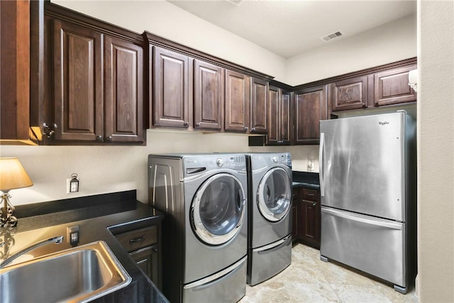 11376 Majestic Dr, Montgomery, TX 77356 - laundry area featuring a sink and washing machine and dryer