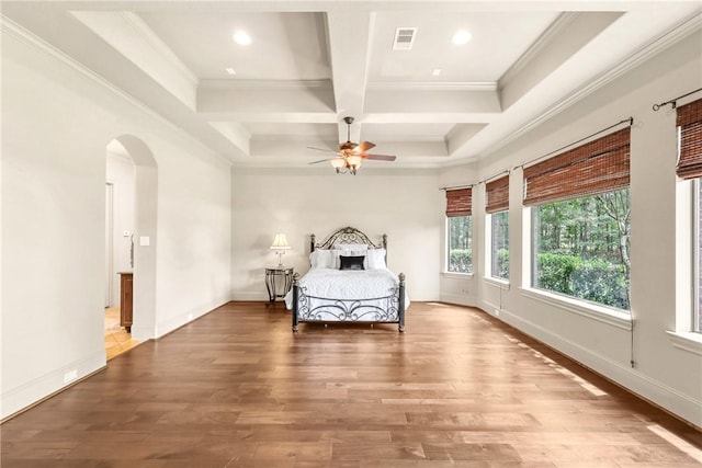 11376 Majestic Dr, Montgomery, TX 77356 - bedroom featuring arched walkways, beamed ceiling, coffered ceiling, ornamental molding, and wood finished floors