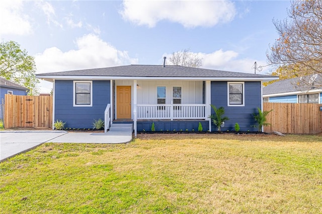 ranch-style home featuring a front yard and a porch