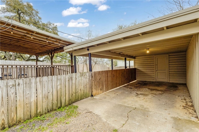 view of patio / terrace with an attached carport