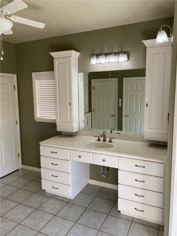 bathroom featuring ceiling fan, tile patterned flooring, and vanity