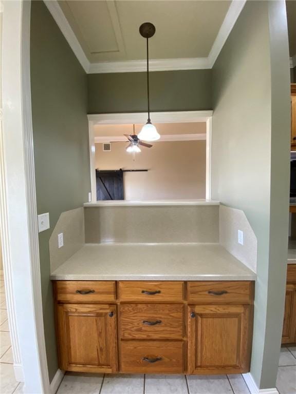 kitchen featuring light tile patterned floors, decorative light fixtures, ceiling fan, and ornamental molding