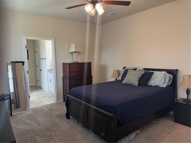 bedroom featuring ceiling fan, visible vents, light carpet, and baseboards