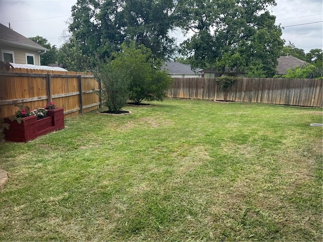 view of yard featuring a fenced backyard