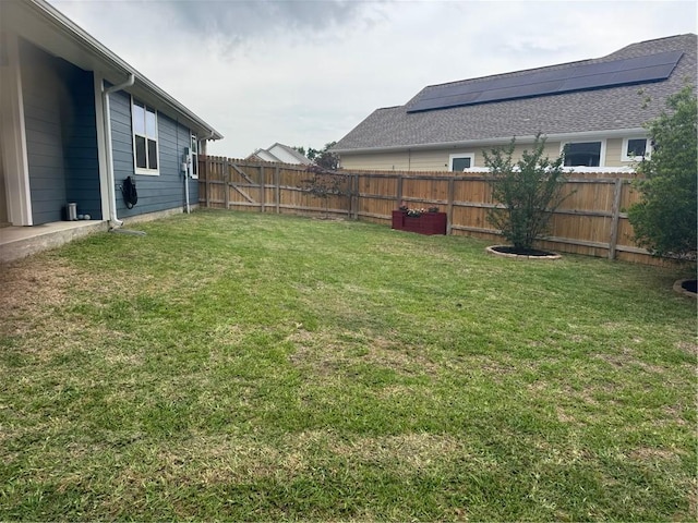 view of yard with a fenced backyard